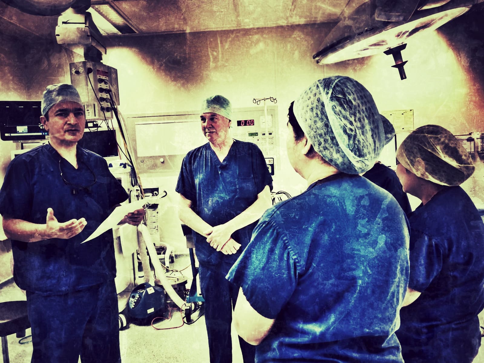 Mr Saboor Khan operating with the surgical team